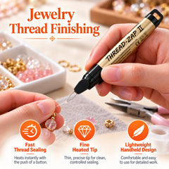 Gold Thread Zap II pen finishing a thread end beside pink and gold jewelry beads