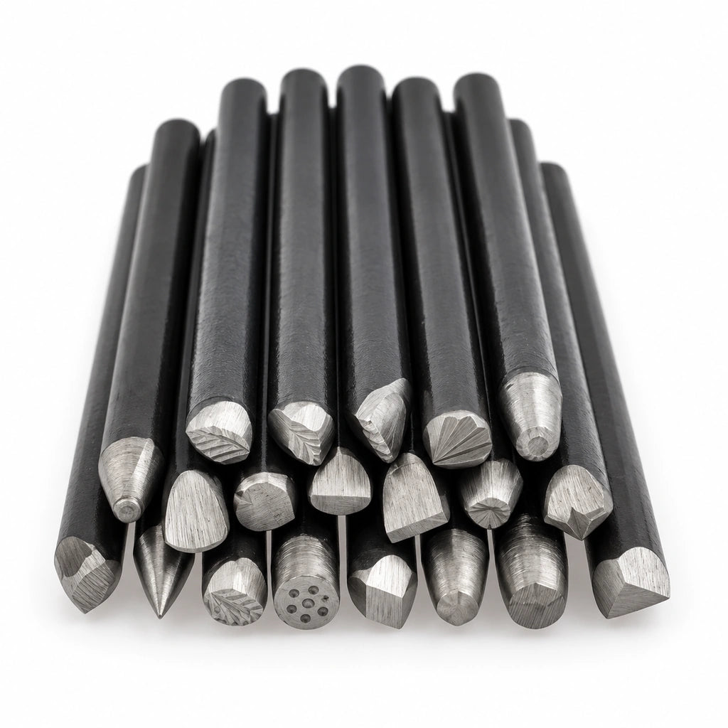 20 iron metal stamping punches arranged on a white background