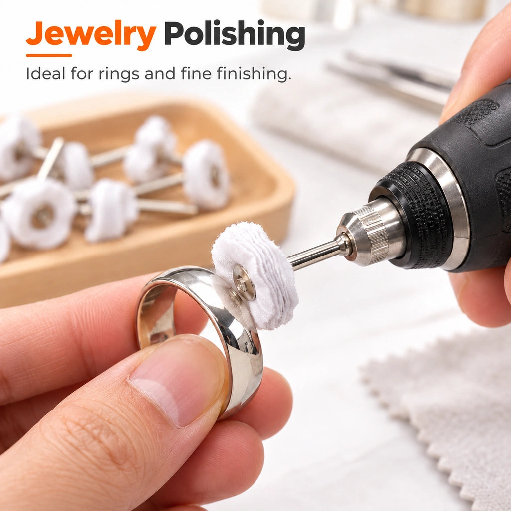 Polishing a silver ring with a white cloth wheel on a rotary tool
